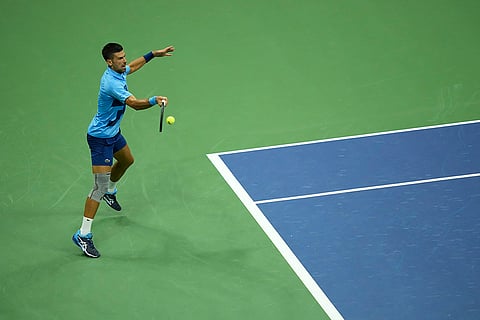 US Open 2024: Novak Djokovic, of Serbia, returns a shot to Radu Albot, of Moldova,